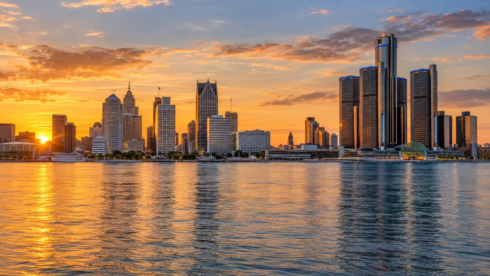 The Detroit skyline at sunset, seen across the river.